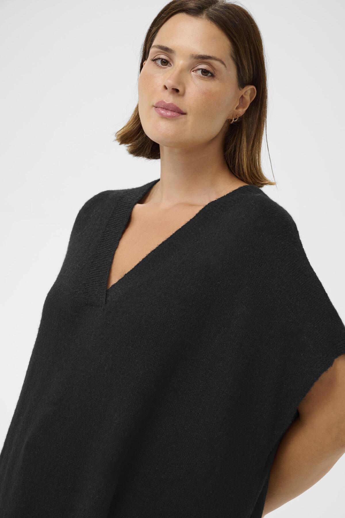 KCannett Strik Poncho Sort